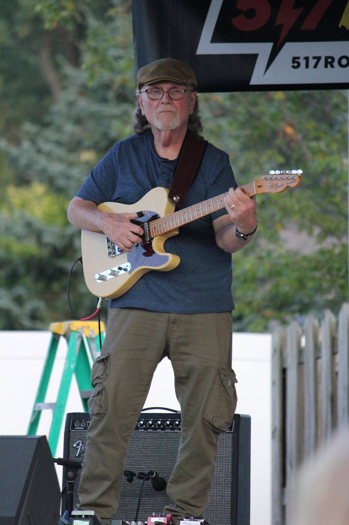 Guitarist playing a butterscotch Fender Telecaster close up