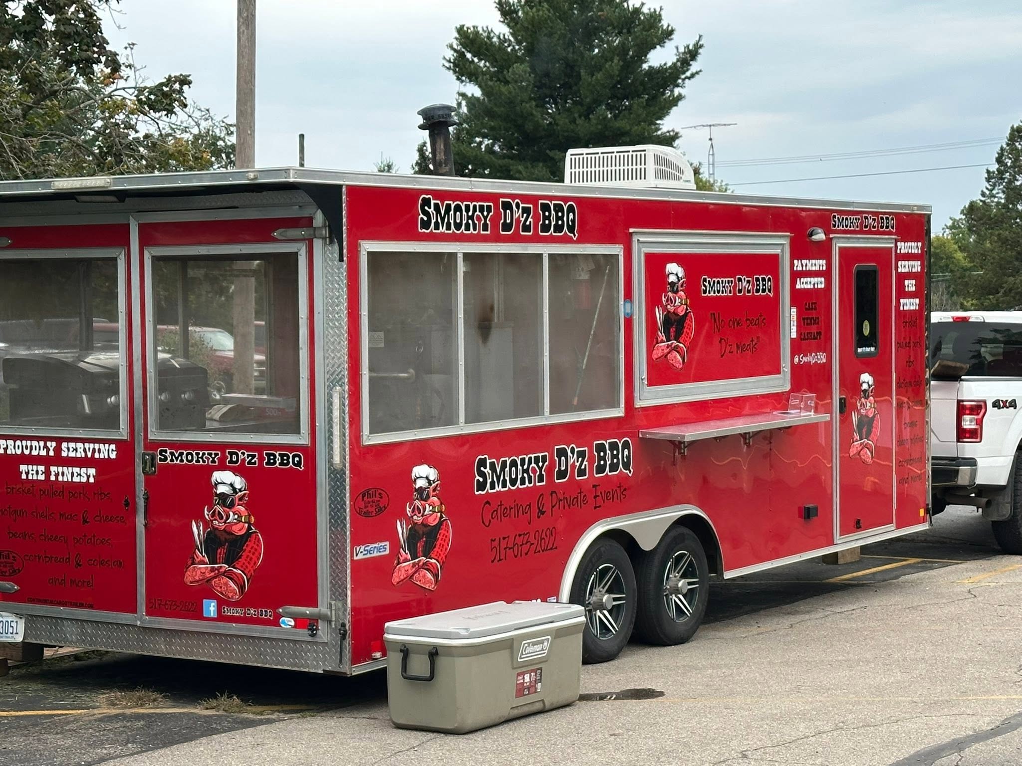 Smoky D'z BBQ food trailer with tough pig mascot