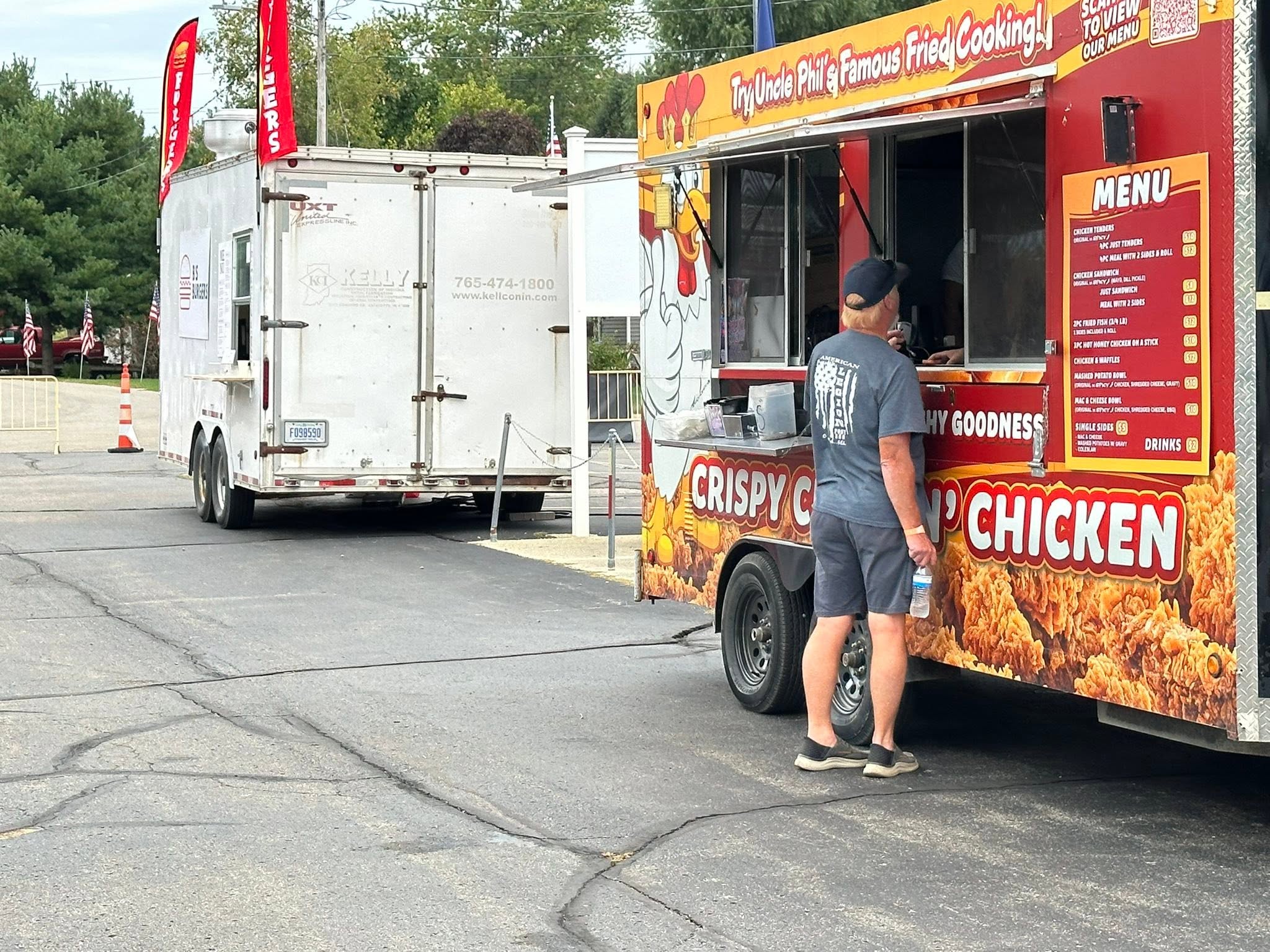 Uncle Phil's Famous Fried Cooking food truck with customer ordering